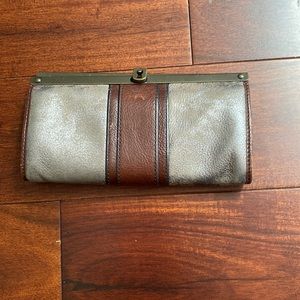 Fossil handbag, good condition, silver, brown/maroon, and has 4+ pockets